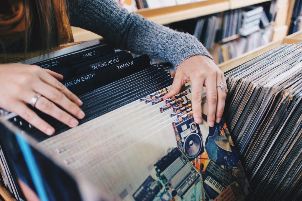 A woman loks through record crates at a music store